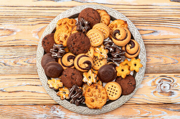 Mix of cookies . Many unhealthy snacks . Top view