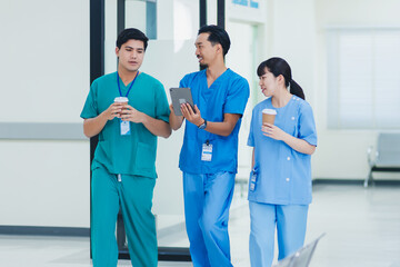 Group of asian doctor nurse with tablet and coffee cup taking coffee break in healthcare hospital