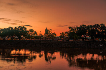 Fototapeta premium Background of the religious tourist attraction Wat Phra Si Rattana Mahathat Woramahawihan, there is a pair of Buddhist statues in Phitsanulok, tourists always come to pay homage.
