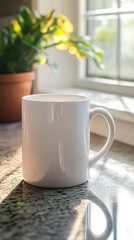 A white coffee mug with a handle sits on a granite countertop in front of a window. The mug is empty and has a soft glow from the sunlight shining through the window.