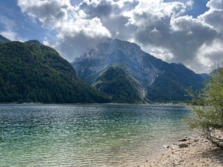 Early autumn over the alpine lake Lago del Predil or Lago di Raibl (Cave del Predil Lake) - Inizio autunno sul alpino Lago del Predil (Cave del Predil, Italia) or Predilsko jezero