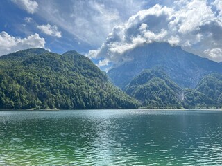 Early autumn over the alpine lake Lago del Predil or Lago di Raibl (Cave del Predil Lake) - Inizio autunno sul alpino Lago del Predil (Cave del Predil, Italia) or Predilsko jezero