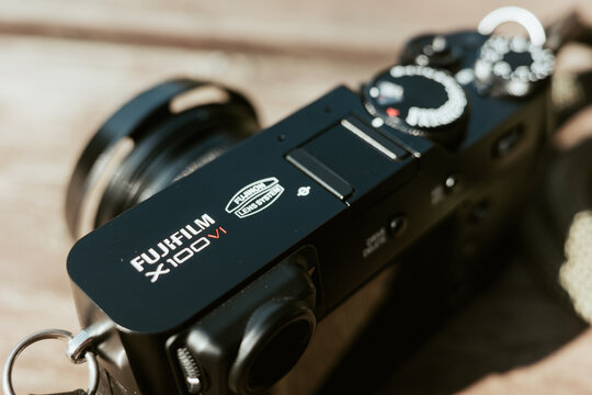 Copenhagen, Denmark - September 8, 2024: Closeup Fuji Film logo on a X100VI camera. Illustrative editorial photo.