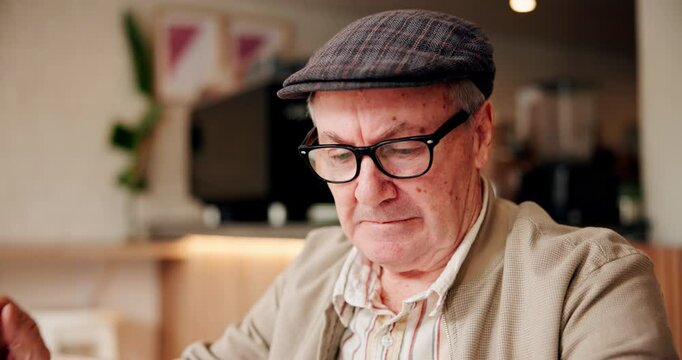 Senior, man and relax with glasses in cafe for eyesight problem, vision correction and glaucoma prescription lens. Elderly, person and wear reading spectacles in restaurant for eye care and eyewear