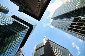 Modern highrises and Office buildings seen from below, in the financial district of a modern city. 