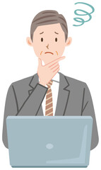 パソコンの前で困っている中年のビジネスマンのイラスト	