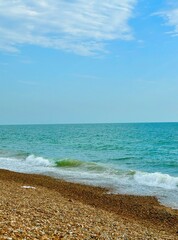 Tranquil Pebble Beach with Gentle Waves
