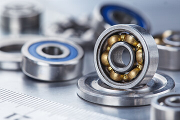 Obraz premium different bearings on a metal background. Part of mechanism.