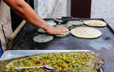 person preparing food, Traditional pre-Hispanic food from Mexico, Nopal en penca from Queretaro