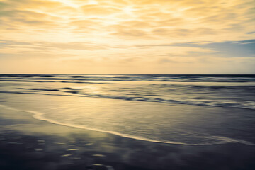 Golden sunset on the beach, abstract seascape, motion blur