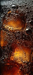 Cola with ice. Close-up of ice cubes in cola water. Texture of a carbonated drink with bubbles in the glass. Cola soda and ice splash, fizz or float to the surface. 