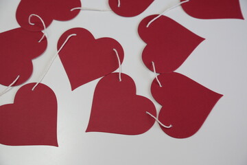 Red paper hearts garland is romantic decoration for Saint Valentine day.