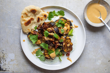 Roasted aubergines with dates, tahini and yogurt