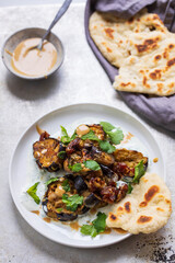 Roasted aubergines with dates, tahini and yogurt