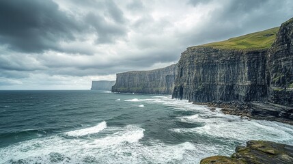 Towering cliffs by the ocean, with waves crashing against the rocky shore under a dramatic cloudy sky