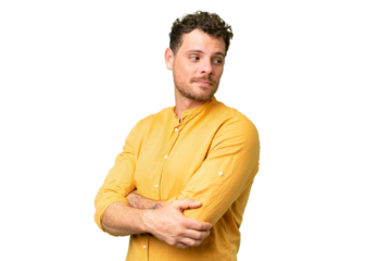 Brazilian man over isolated chroma key background looking to the side