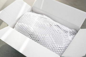 Corrugated white paper for safe transportation, in which the goods brought by the courier delivery service are wrapped, environmental packaging concept