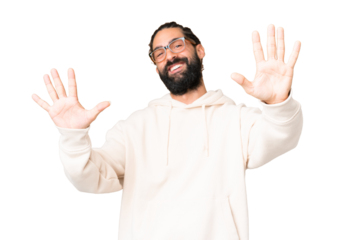 Young man with beard over isolated chroma key background counting ten with fingers