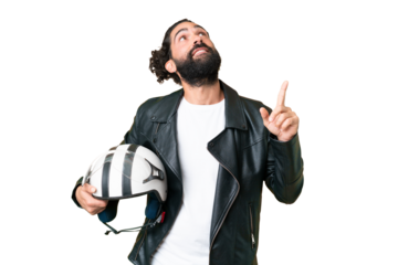 Young man with beard with a motorcycle helmet over isolated chroma key background pointing up a great idea