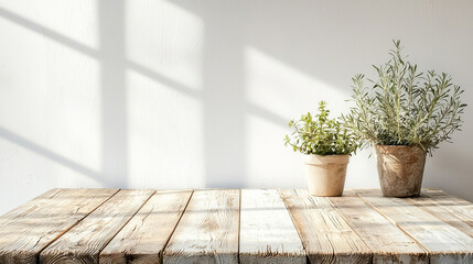 A wooden table with two potted plants on it