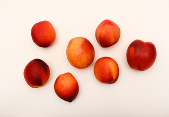 Juicy peaches on a white background. Ripe nectarines.