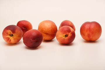 Juicy peaches on a white background. Ripe nectarines.