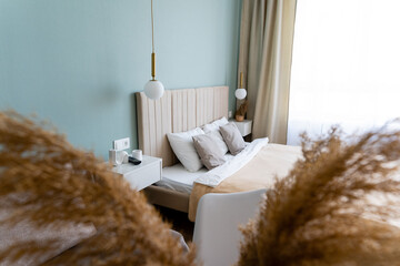 Experience the warmth of a cozy modern bedroom adorned with natural accents and softly diffused...