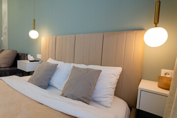 The bedroom is beautifully furnished with a cozy bed, sleek nightstand, stylish lamp, and comfortable couch, creating a delightful atmosphere perfect for relaxation after a long day