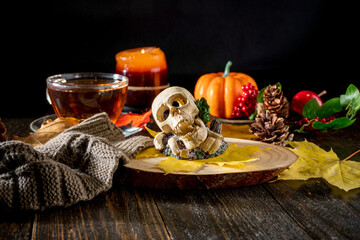 Autumn Decor with Scarves, Pumpkins, Candles, and Yellow Leaves