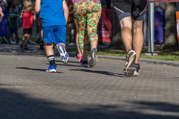 Feet of marathon runners. Runners on the street. Healthy lifestyle.