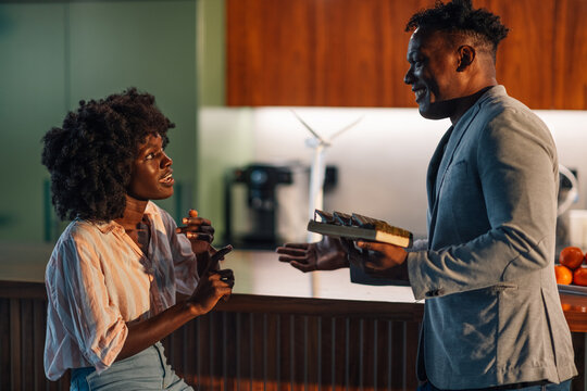 Diverse colleagues discussing solar energy and sustainability at office