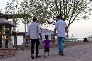 Obraz premium family spending quality time together at outdoor park at evening