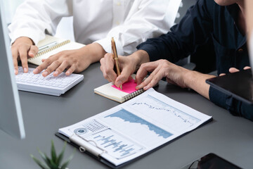 Group of diverse office worker employee take note and brainstorming on strategic business marketing planning with sticky note in office workspace. Positive and productive teamwork in workplace.Prudent