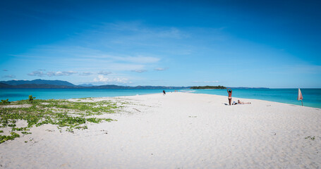 Obraz premium Discovering the serene beauty of Nosy Iranja Island in Madagascar on a sunny day at the beach with soft white sand and turquoise waters