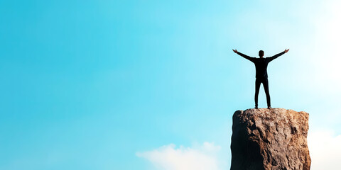 Person standing at the edge of a cliff with arms outstretched, ready for a new beginning