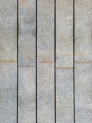 Gray pavement background. Aerial view of rectangular cement tiles. Gray cement wall. Architecture and construction