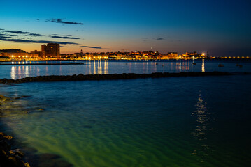 View of a beach with a sunrise in the background
