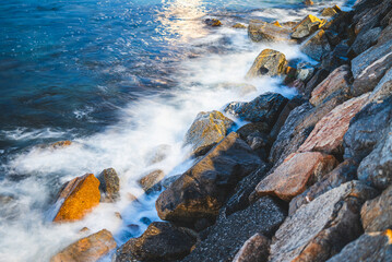 rocks in the sea on a sunny day