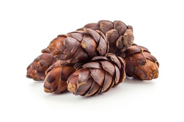 A pile of pine cones arranged on a clean white surface
