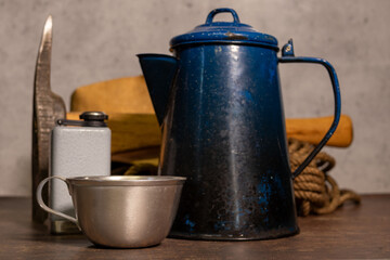 Vintage Tin Cup and Coffee Pot on work bench