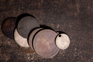 Antique coins worn from use flat lay