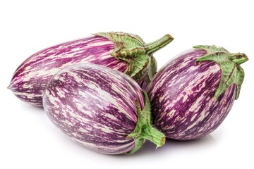 Freshly harvested eggplants on a clean white surface
