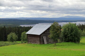 Obraz premium Summer day in August with clouds. Distance landscape nature photo. Jämtland, Sweden, Europe.