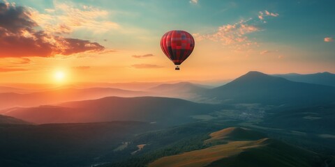 Fototapeta premium A vibrant hot air balloon soars above a scenic mountain landscape during sunset, representing adventure and freedom.