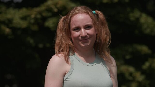 Happy transwoman looks at the camera