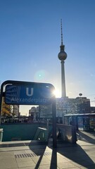 View of the Alexanderplatz U-Bahn station entrance with the iconic Berlin TV Tower in the...