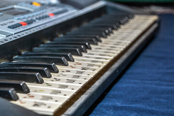 Piano keyboard with chords pasted on the keys	
