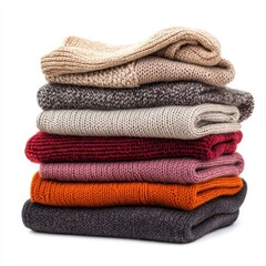 Stack pile of folded wooley knit cloth isolated on white background 