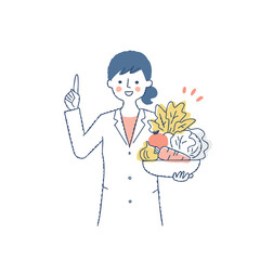 野菜を抱えて説明している栄養士の女性