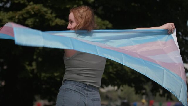Trans woman with a trans pride flag